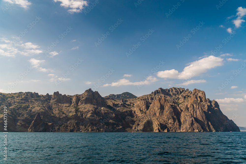 The Crimean Peninsula. July 21, 2021. Picturesque view of the high cliffs at Cape Karagach from the Black Sea.