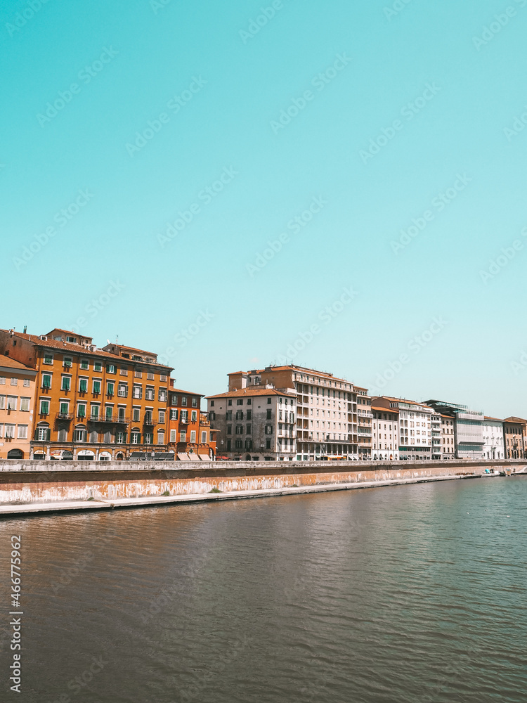 Street view of promenade next to Arno River in Pisa in Italy