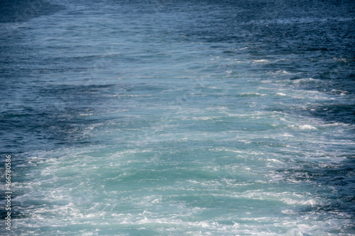 Seascape of water behind a ferry ship in fjord in North Iceland