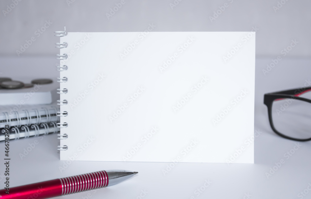 Notepad with eyeglasses and text documents. Business concept Notepad with eyeglasses and text documents. Business concept