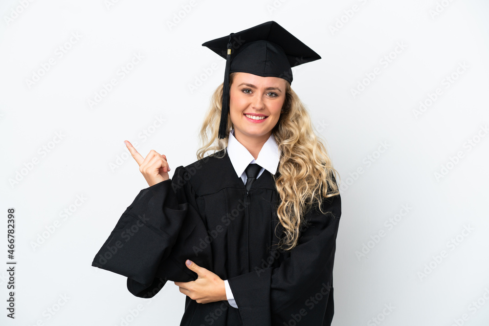 Young university graduate woman isolated on white background pointing finger to the side Young university graduate woman isolated on white background pointing finger to the side