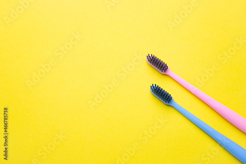 A toothbrush on a yellow background . Silicone toothbrush. Copy space. Yellow background. Dental care. Dentistry.