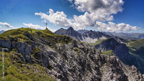 top of the alps with cross