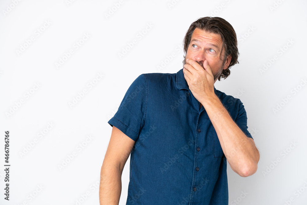Senior dutch man isolated on white background doing surprise gesture while looking to the side Senior dutch man isolated on white background doing surprise gesture while looking to the side