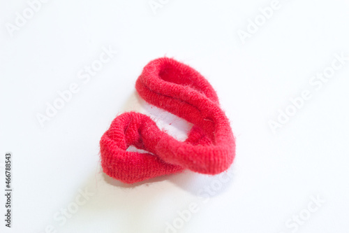 Red hair elastic on white background.