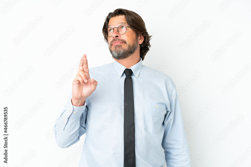 Senior dutch business man isolated on white background with fingers crossing and wishing the best Senior dutch business man isolated on white background with fingers crossing and wishing the best