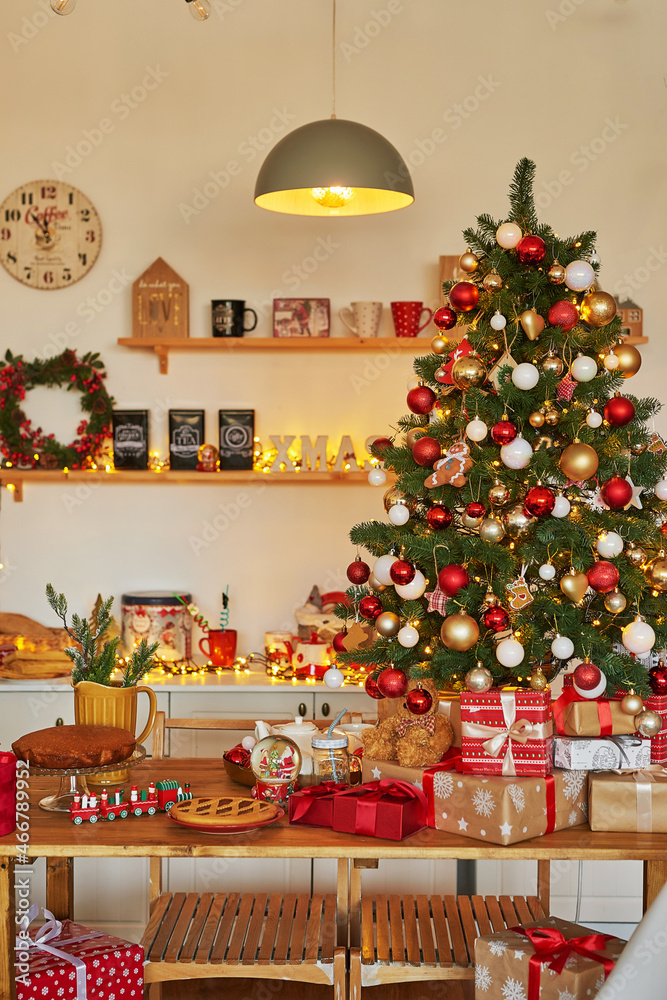 Christmas kitchen. Red and gold decor christmas tree background. New Year celebration. Merry Christmas and Happy New Year.