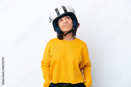 Woman with a motorcycle helmet and looking up
