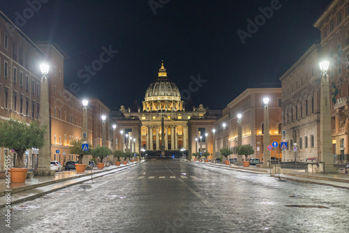 The illuminated St. Peter s dome in Vatican City late evening after a short rainfall.