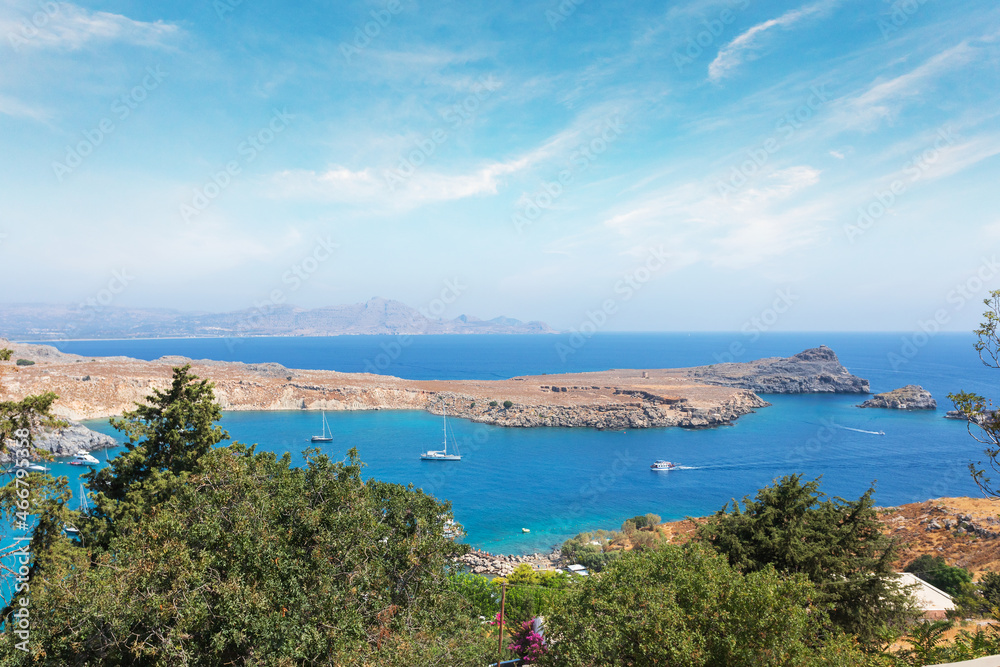 View from the hill of the Acropolis on the Mediterranean coast in the city of Lindos, Rhodes island, Greece