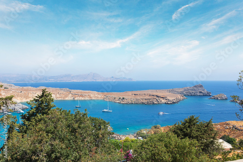 Fototapeta Naklejka Na Ścianę i Meble -  View from the hill of the Acropolis on the Mediterranean coast in the city of Lindos, Rhodes island, Greece