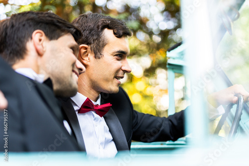 Gay couple celebrating their wedding photo