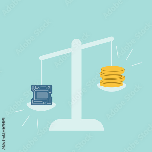 On the scales there is a microchip and coins. The cost of electronic microcircuits is increasing due to the global shortage of microchips.