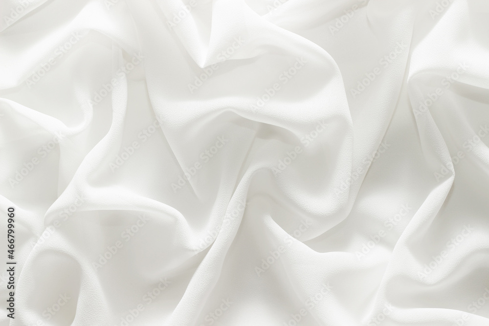 Obraz premium white material flows in soft folds background