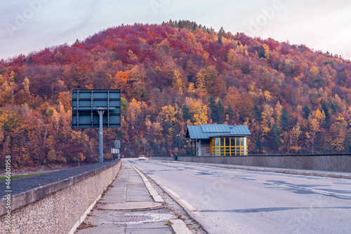 Fototapeta Naklejka Na Ścianę i Meble -  Road over the water dam in Tresna, Silesia, Poland. Beautiful, evening in polish mountains Beskidy.