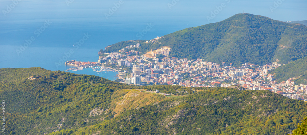 Aerial view of Budva Town in Montenegro . Panorama of Adriatic Coast and green mountains