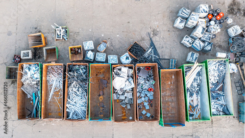 Containers from a height with different types of metal, Sorting for remelting metal products photo