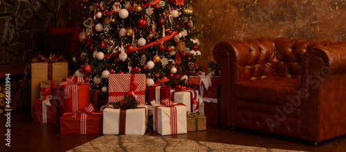 Fototapeta Naklejka Na Ścianę i Meble -  Christmas, New Year's interior. Beautifully luxury decorated Christmas tree, boxes with gifts,leather brown armchair, firewood on the background of a brown modern wall and a stone gray wall.