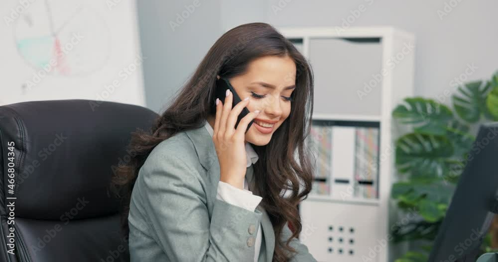 Corporate head businesswoman spends afternoon at work in office in front of computer, makes business calls, talks on phone with company partners, confirms meetings, scheduled conferences Corporate head businesswoman spends afternoon at work in office in front of computer, makes business calls, talks on phone with company partners, confirms meetings, scheduled conferences