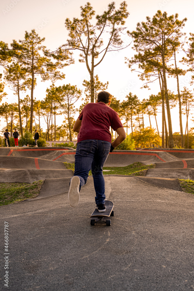 Fototapeta premium Skateboarder practice on a pump track park