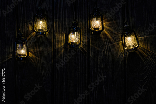 Vintage background. Christmas light bulbs on old wood background