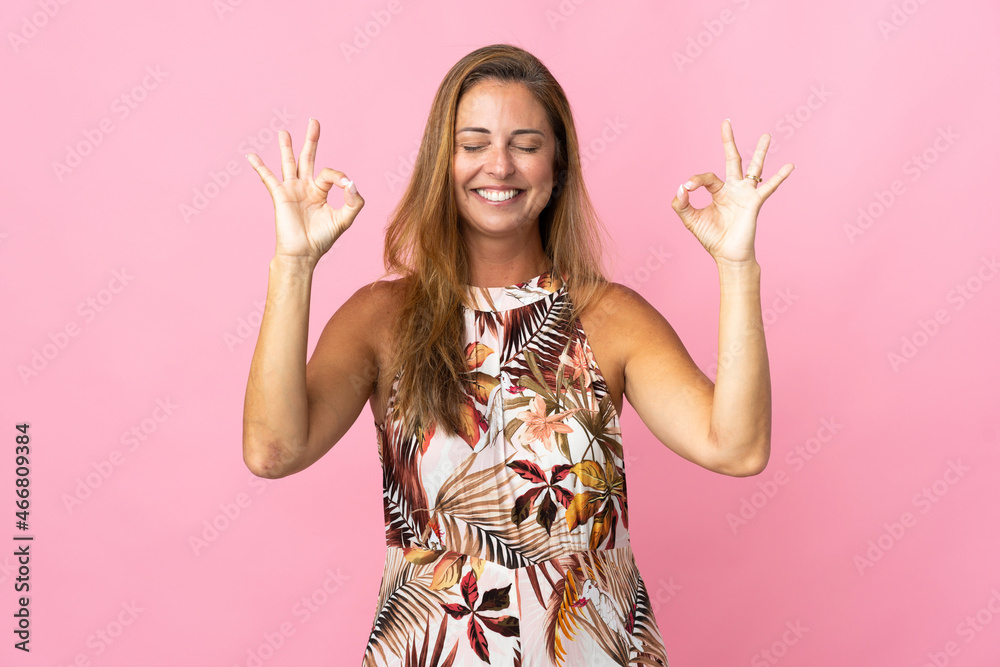 Middle age brazilian woman over isolated background in zen pose Middle age brazilian woman over isolated background in zen pose