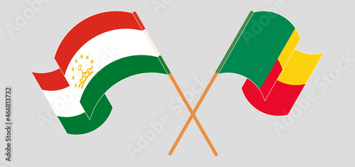 Crossed flags of Tajikistan and Benin. Official colors. Correct proportion