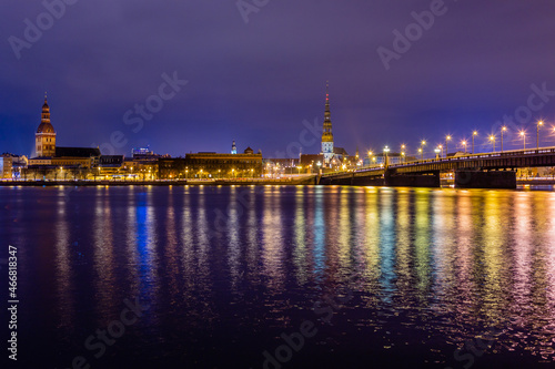 Night view to the historical city center and Stone bridge from the banks of Daugava river colored with street lights  Riga  Latvia