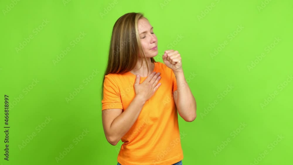 Young blonde girl is suffering with cough and feeling bad over isolated background. Green screen chroma key