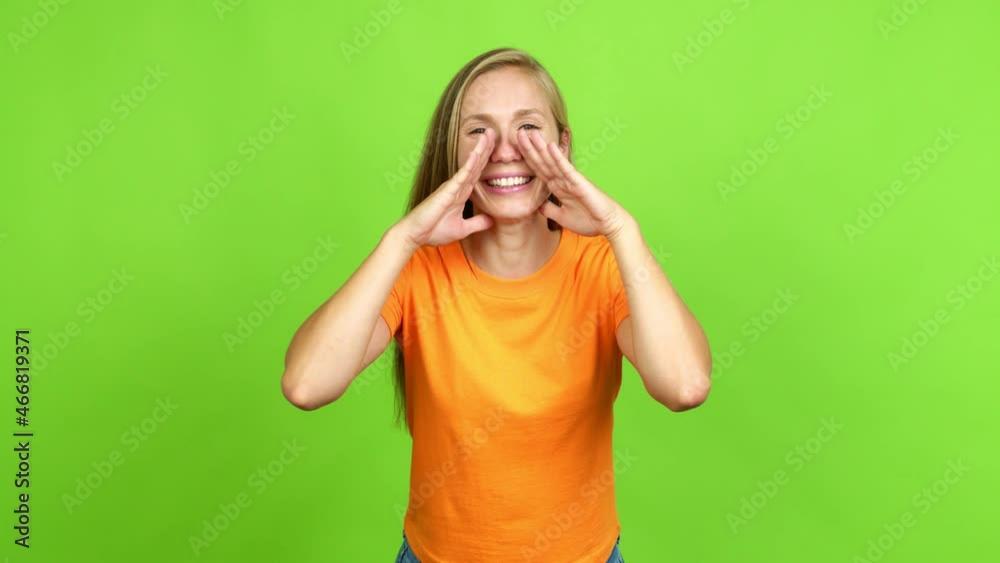Young blonde girl shouting and announcing something over isolated background. Green screen chroma key Young blonde girl shouting and announcing something over isolated background. Green screen chroma key