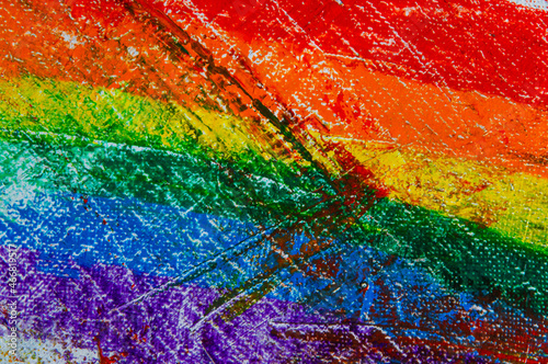 several strokes of multi-colored paint depict a frag of the LGBT community on a light surface. short focus  blur. A temporary object  not a piece of art.