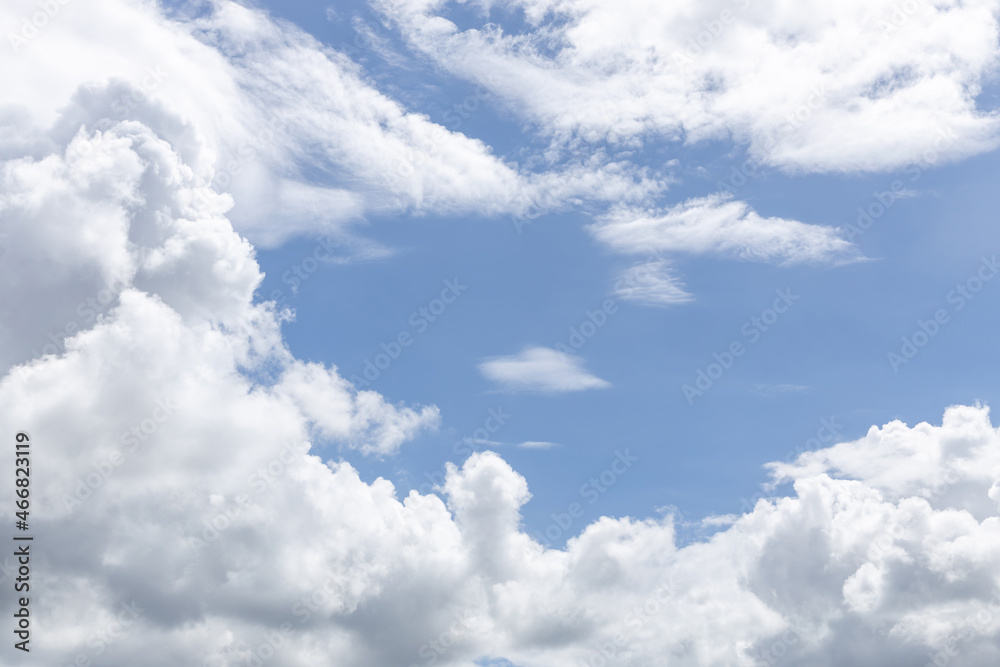 white fluffy clouds in the blue sky .blue sky background with tiny clouds white fluffy clouds in the blue sky .blue sky background with tiny clouds