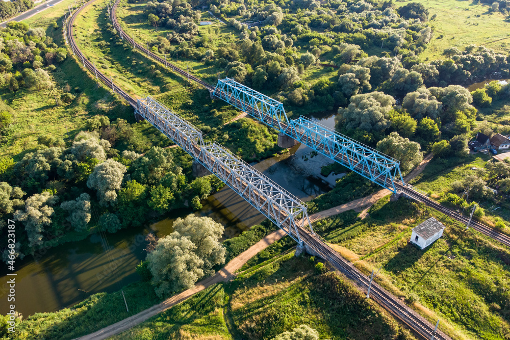 Railway bridge over the river, an old construction from the early 20th century. Protva River, Kaluzhskiy Region, Russia