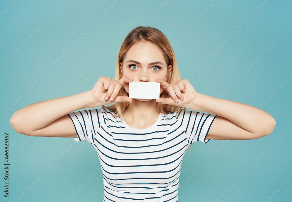 Fototapeta premium pretty woman with a business card in hand Lifestyle Studio
