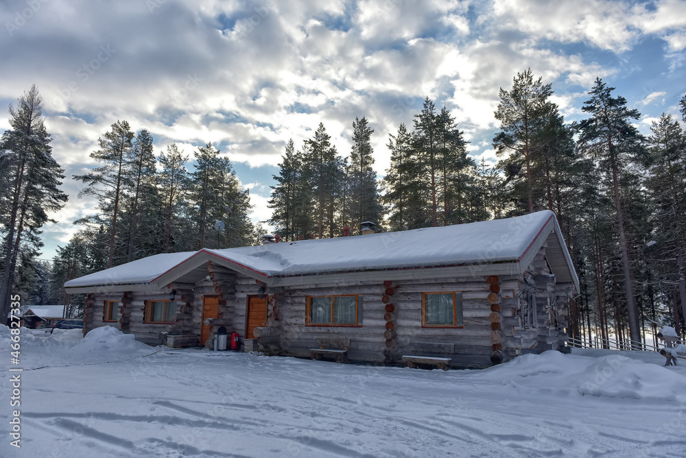 log cabin in a pine forest in winter log cabin in a pine forest in winter