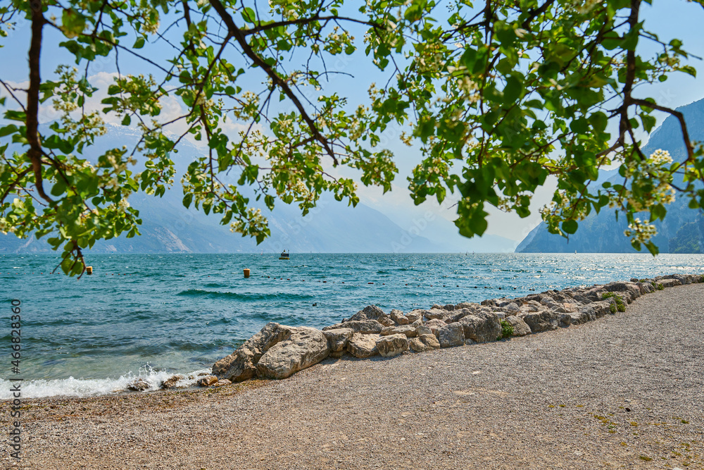 View of the beautiful Lake Garda surrounded by mountains,Riva del garda and Garda lake in the spring time,Trentino Alto Adige region View of the beautiful Lake Garda surrounded by mountains,Riva del garda and Garda lake in the spring time,Trentino Alto Adige region