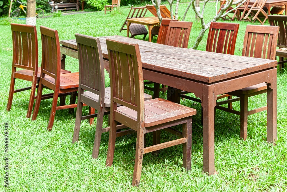 Long brown wooden table for dining in the courtyard