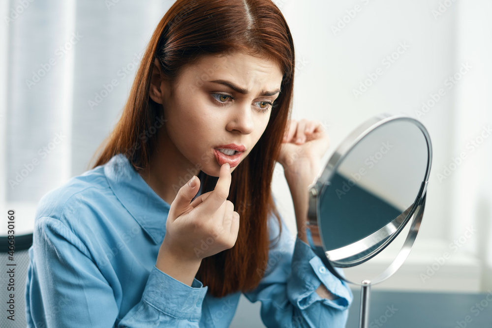 woman looking in the mirror cosmetics personal care woman looking in the mirror cosmetics personal care