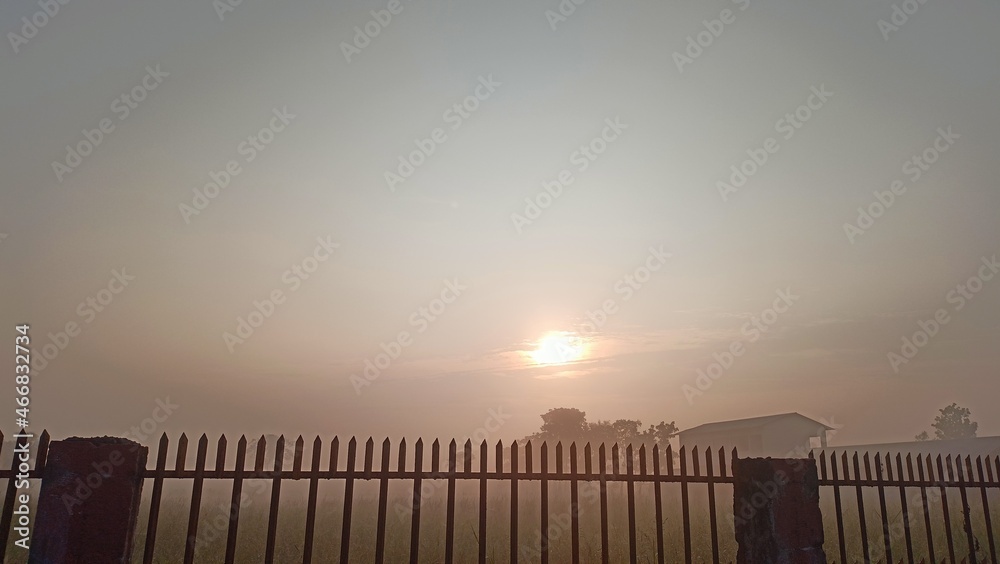 sunrise over the fence