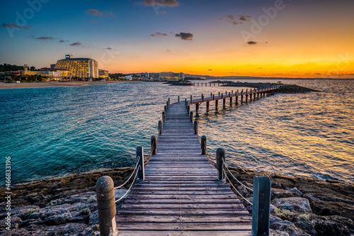 Sunset in Okinawa, Japan, taken at Onna Son, on a raised wooden jetty linking artificial islands in a lagoon