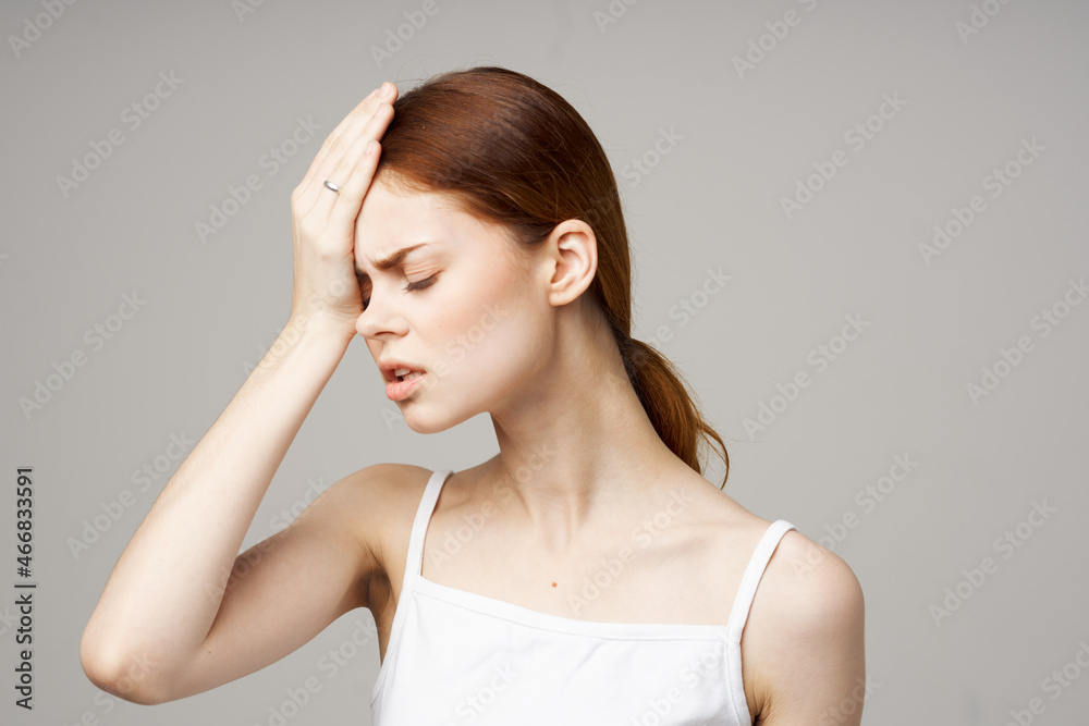 woman holding head migraine disorder studio treatment woman holding head migraine disorder studio treatment