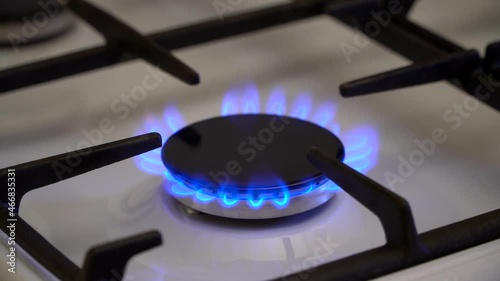 Gas burning in the burner of gas stove, gas shortage and crisis