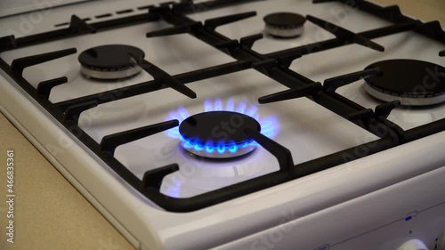 Gas burning in the burner of gas stove, gas shortage and crisis