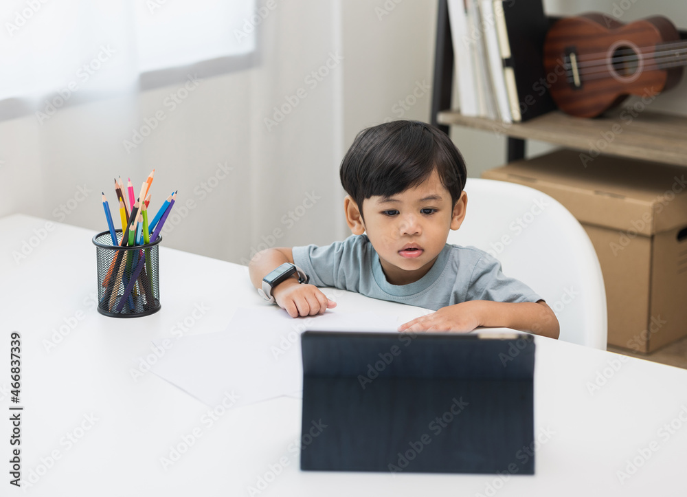 Asian little boy education from home. Developing children's learning before entering kindergarten Practice the skills of drawing and painting. Asian little boy education from home. Developing children's learning before entering kindergarten Practice the skills of drawing and painting.