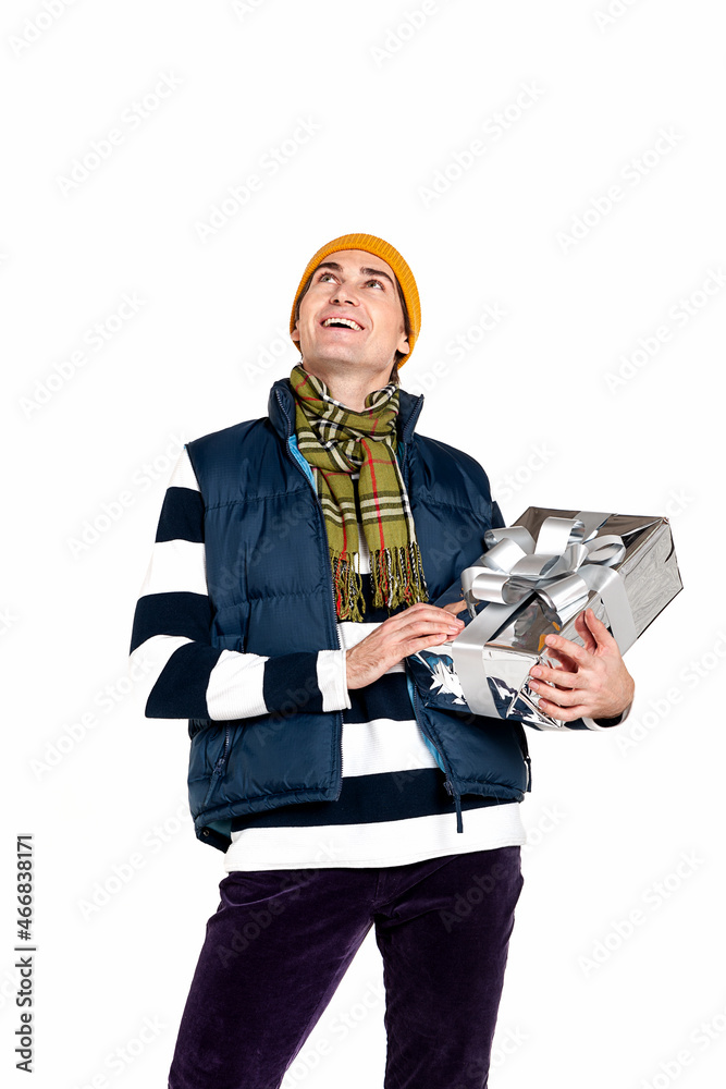 Handsome smiling man with new year gifts on white background Handsome smiling man with new year gifts on white background