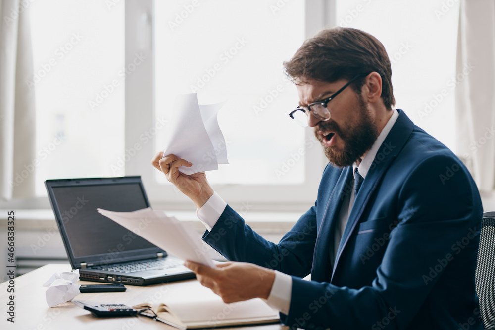 manager working for a laptop in the office emotions discontent official manager working for a laptop in the office emotions discontent official