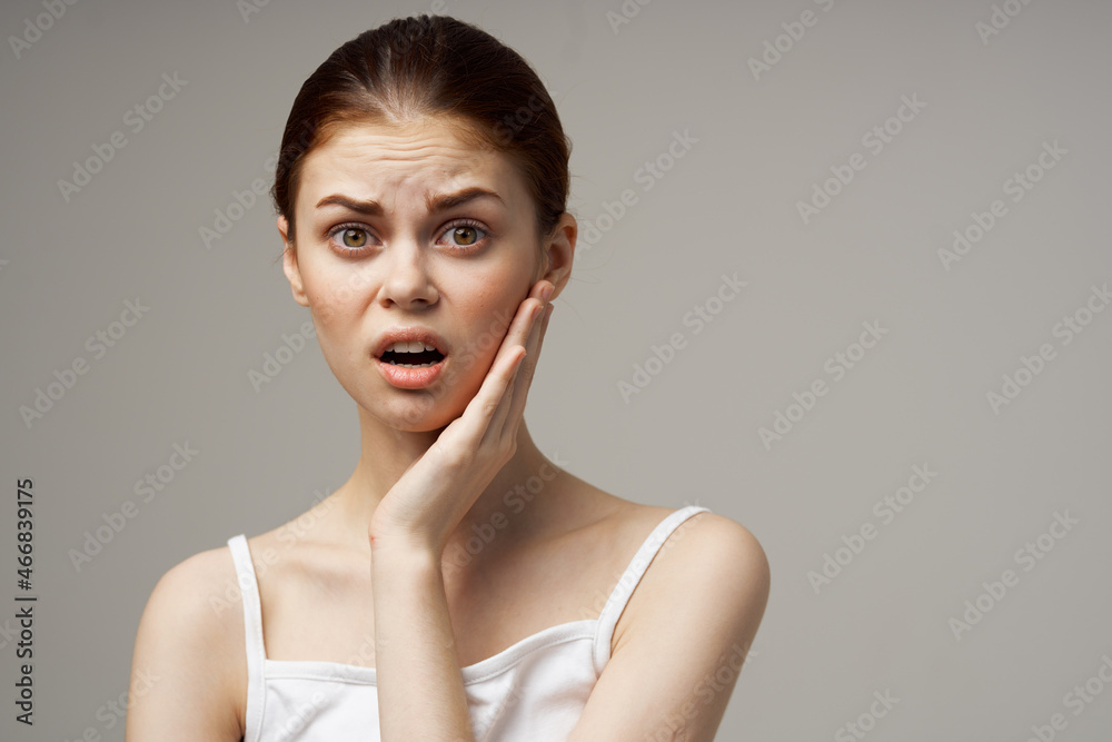 disgruntled woman dentistry dental pain close-up studio treatment