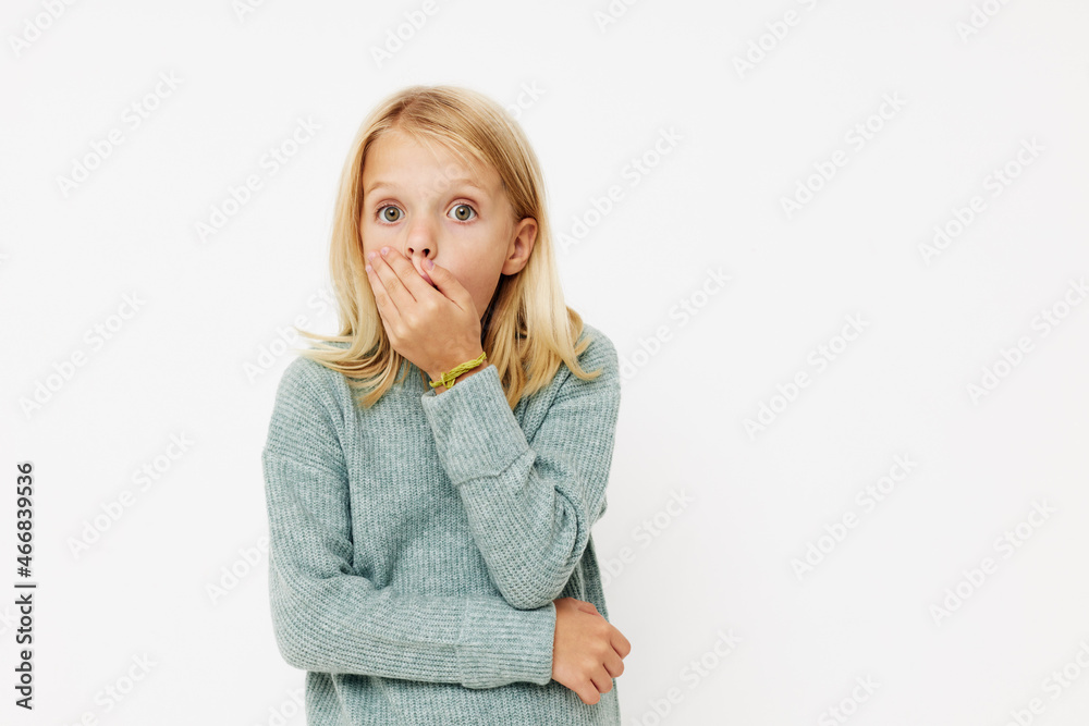 Little cute girl gestures with his hands posing studio Little cute girl gestures with his hands posing studio