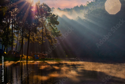 Camping Adventures Camping and tent under the pine forest near water outdoor in morning and sunset at Pang-ung  pine forest park   Mae Hong Son  North of Thailand  forest background. Concept Travel