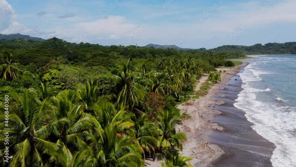 Beautiful Costarica beach Aerial view of the idyllic summer tropical landscape with green palm trees, sea coast and white sand Beautiful Costarica beach Aerial view of the idyllic summer tropical landscape with green palm trees, sea coast and white sand